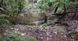 Southern Waitete Municipal Water Supply dam, looking from upstream across the now empty reservoir. 2005.